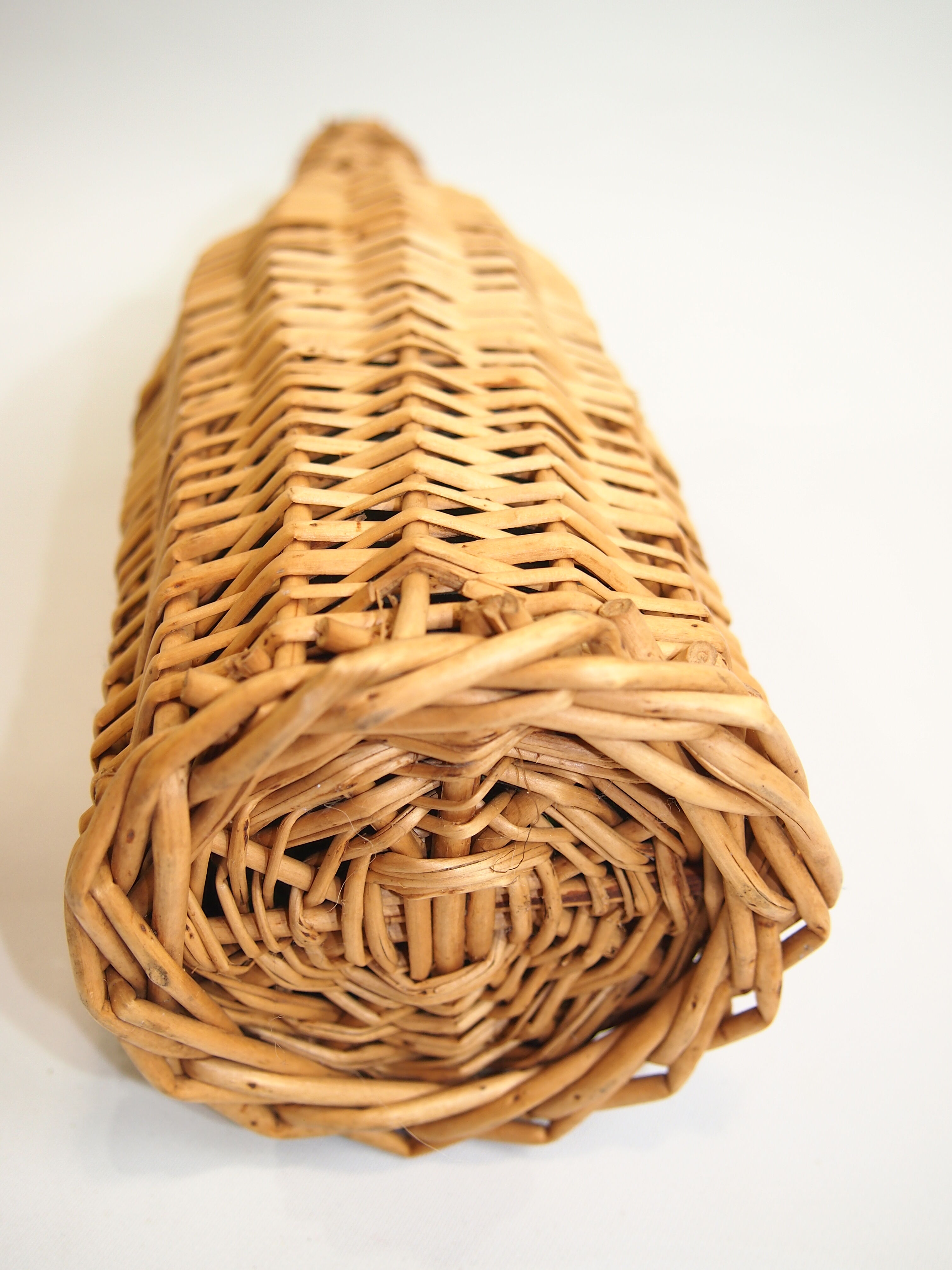 Bottle dressed in rattan