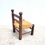 Low chair in turned wood and straw