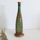 Glass and wicker bottle