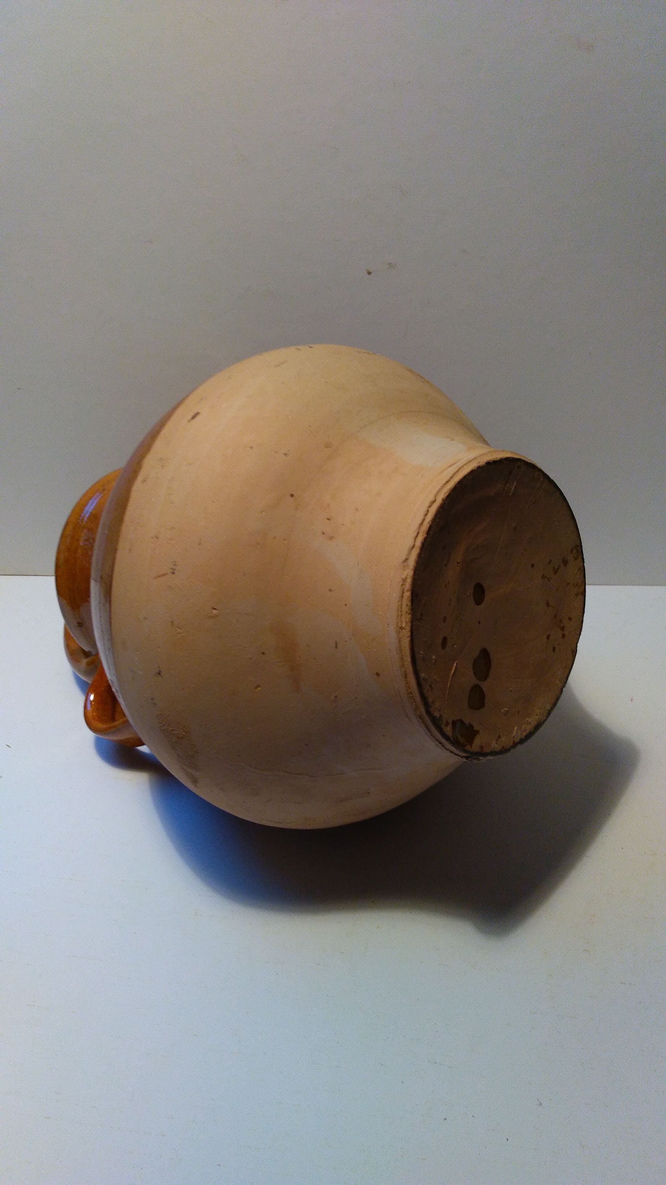 Old glazed earth jug