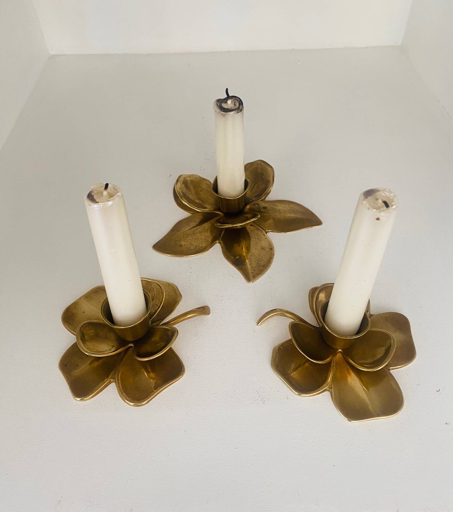 Set of 3 old brass candlesticks in the shape of flowers