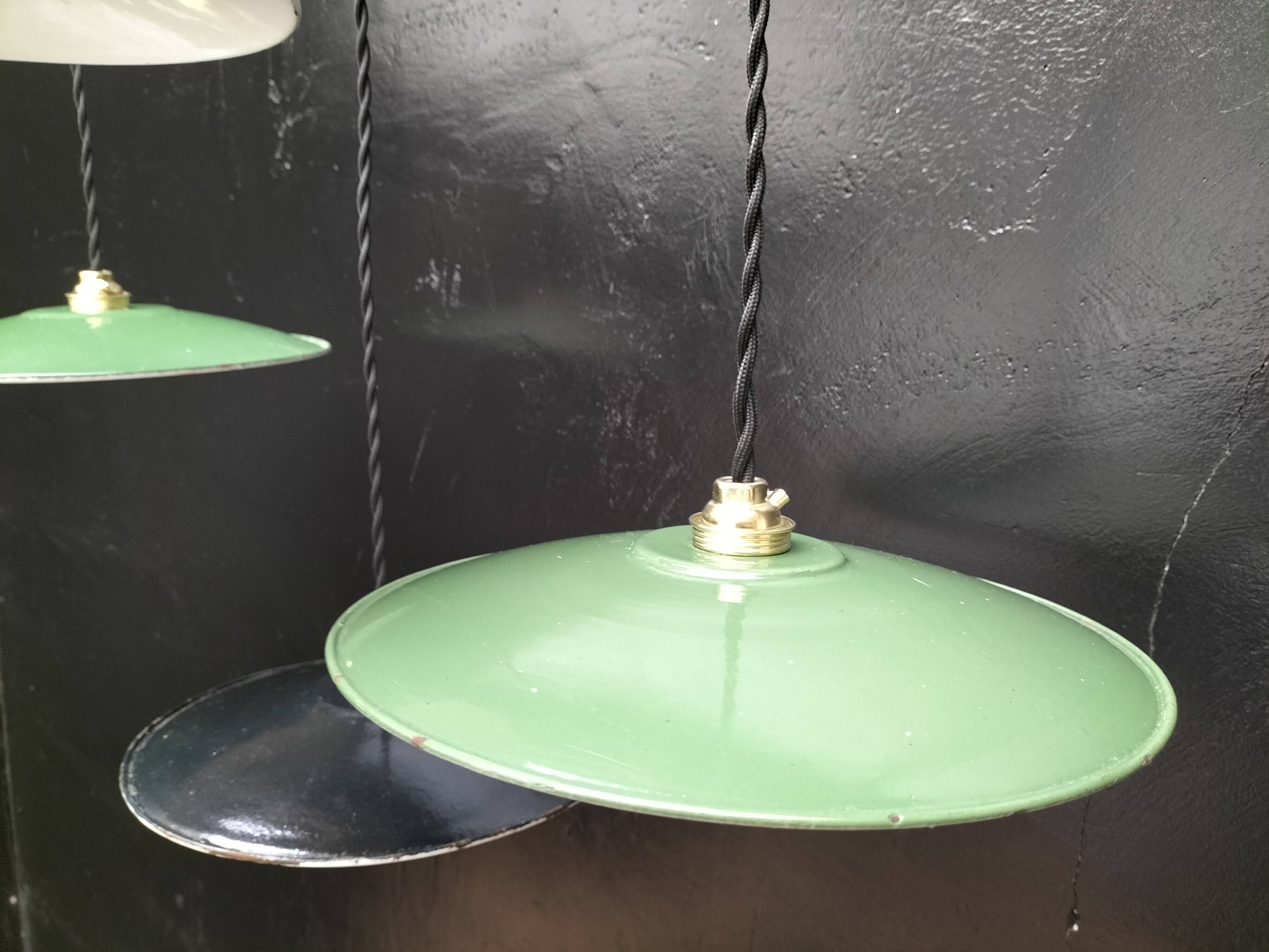 4 enameled sheet metal pendants