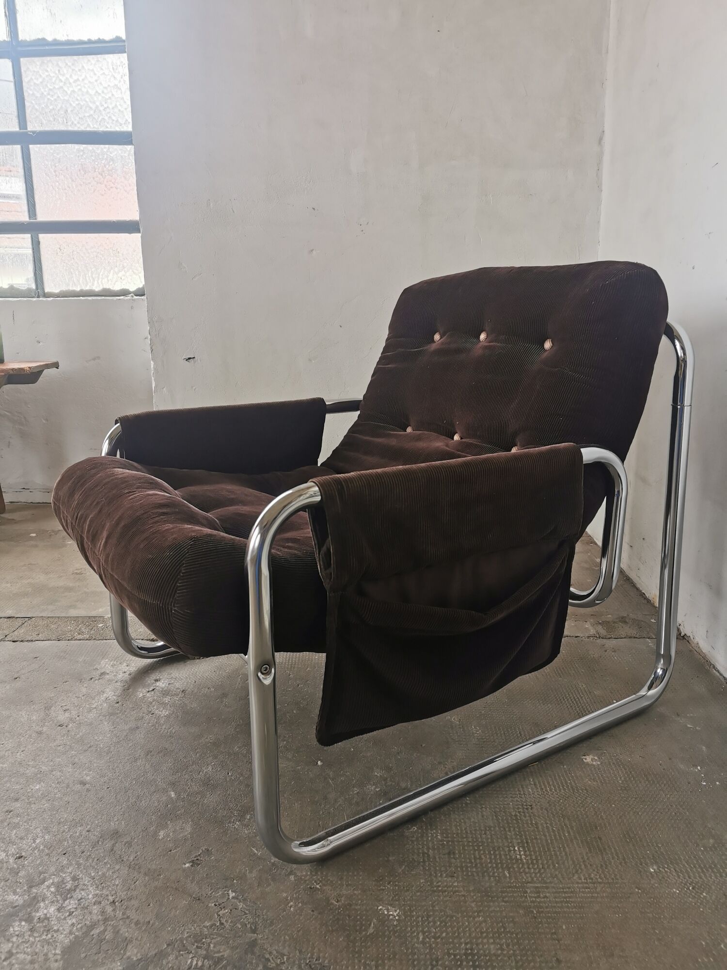 Velvet and tubular metal armchair 1980