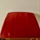Vintage rocking footstool in red Skai and wood