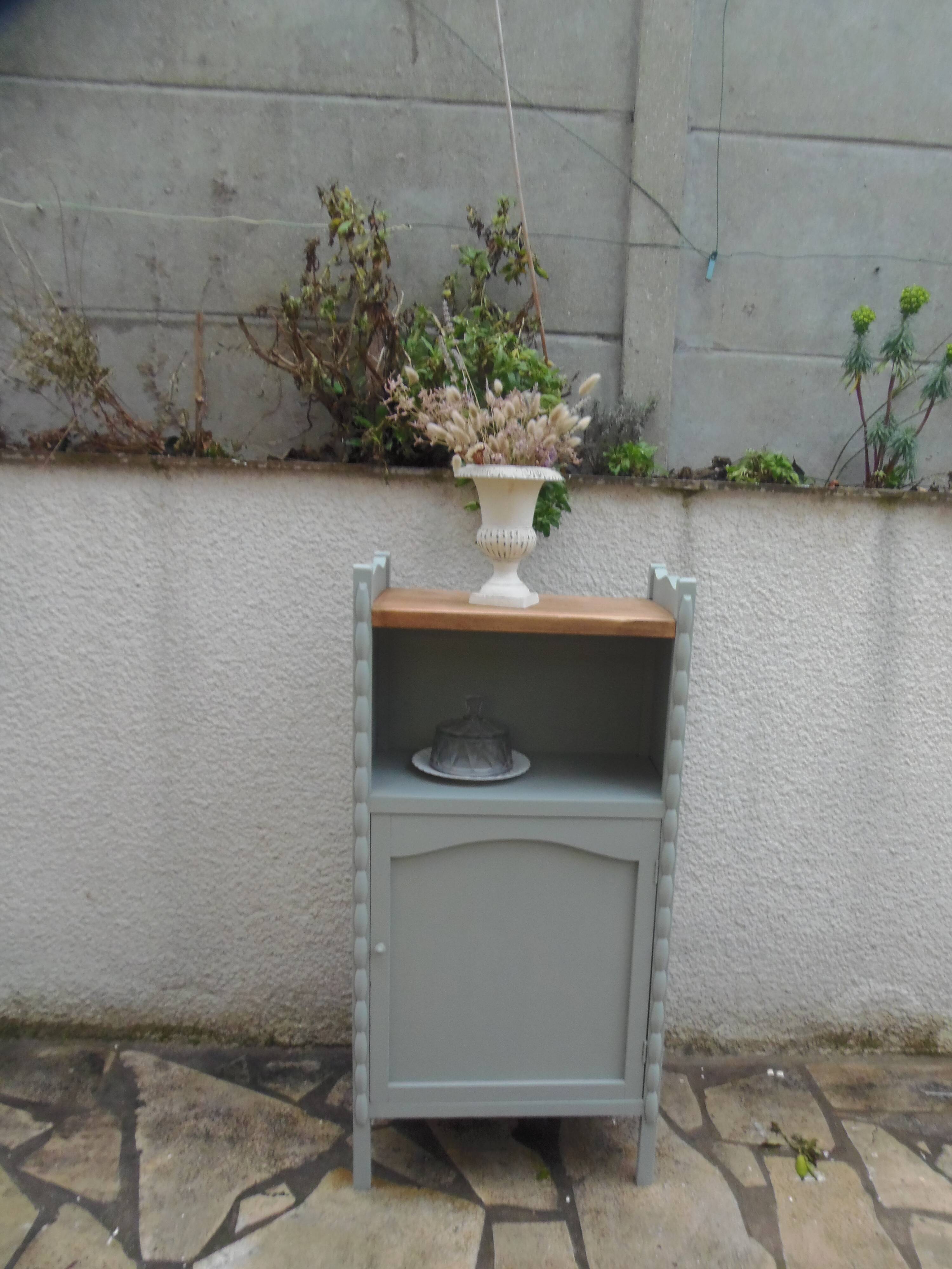 Vintage furniture of shallow depth re-enchanted in grey-green.