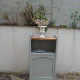 Vintage furniture of shallow depth re-enchanted in grey-green.