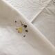 Oval tablecloth and napkins in white cotton embroidered in color