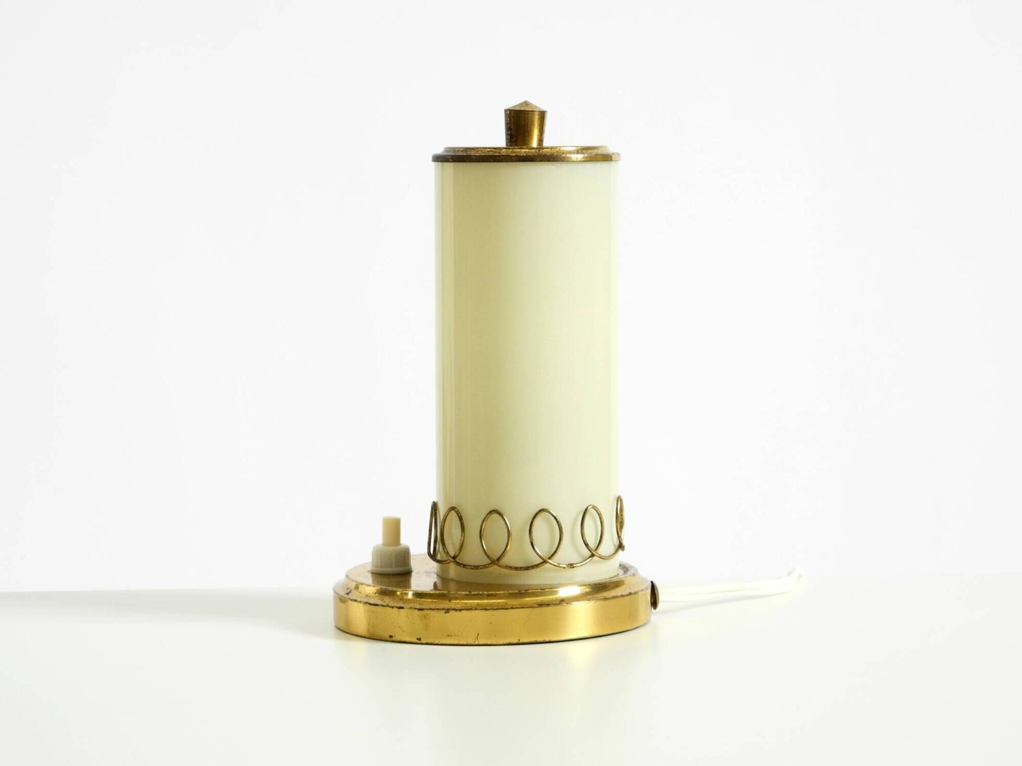 A beautiful, rare 1950s brass table lamp with one opal glass shade adorned