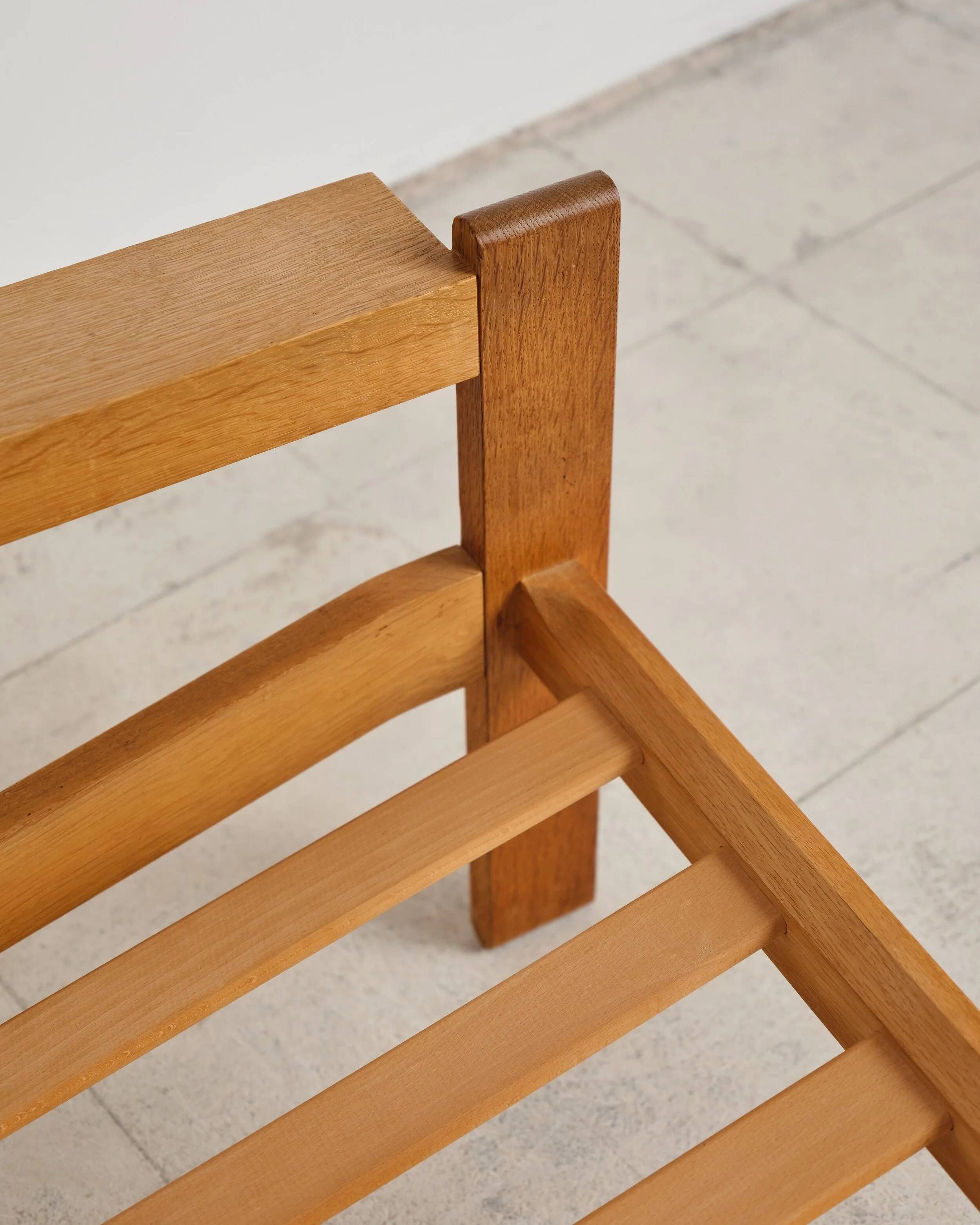 Brutalist armchair in oak and leather by Tage Poulsen, Denmark, 1970s.