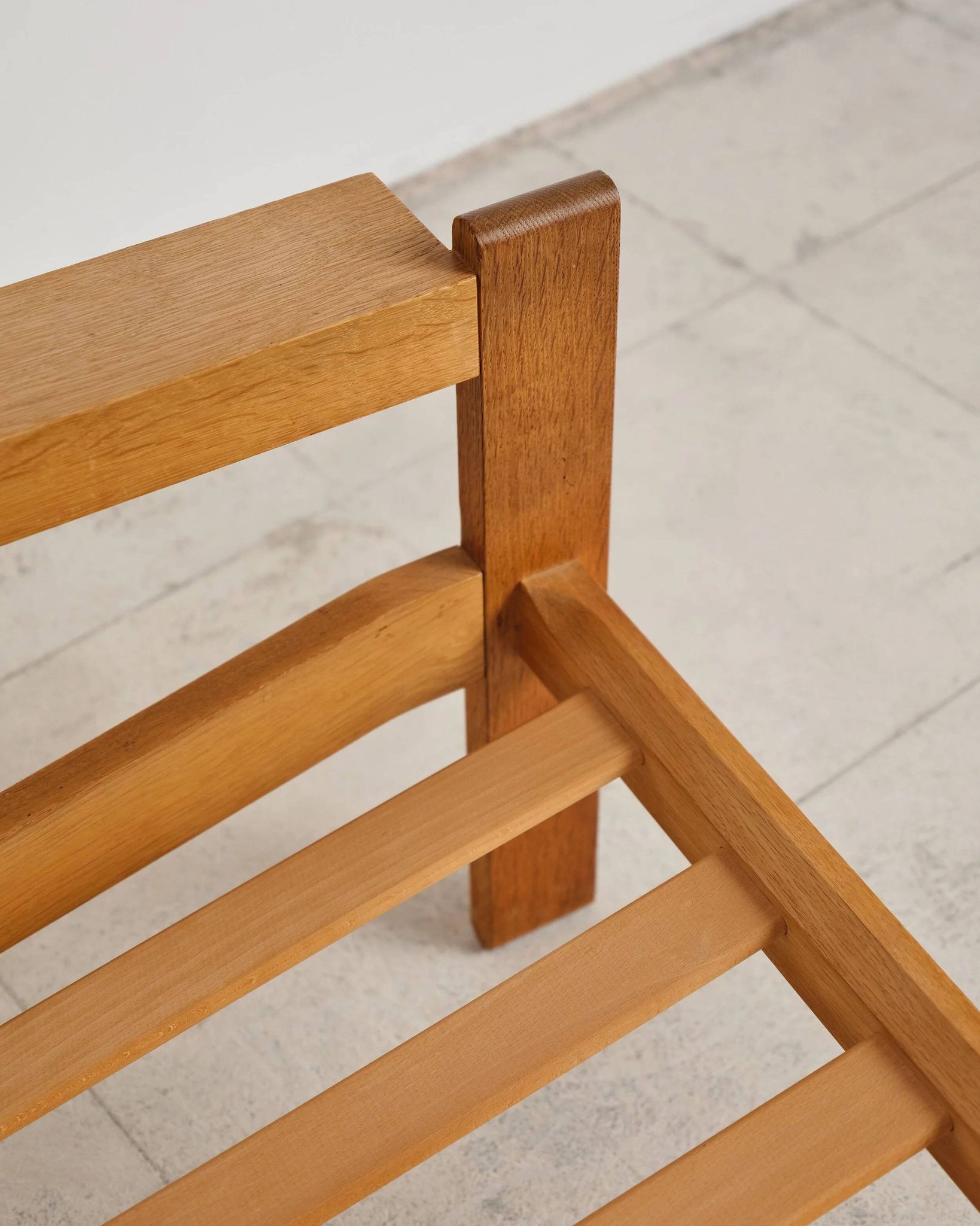 Brutalist armchair in oak and leather by Tage Poulsen, Denmark, 1970s.