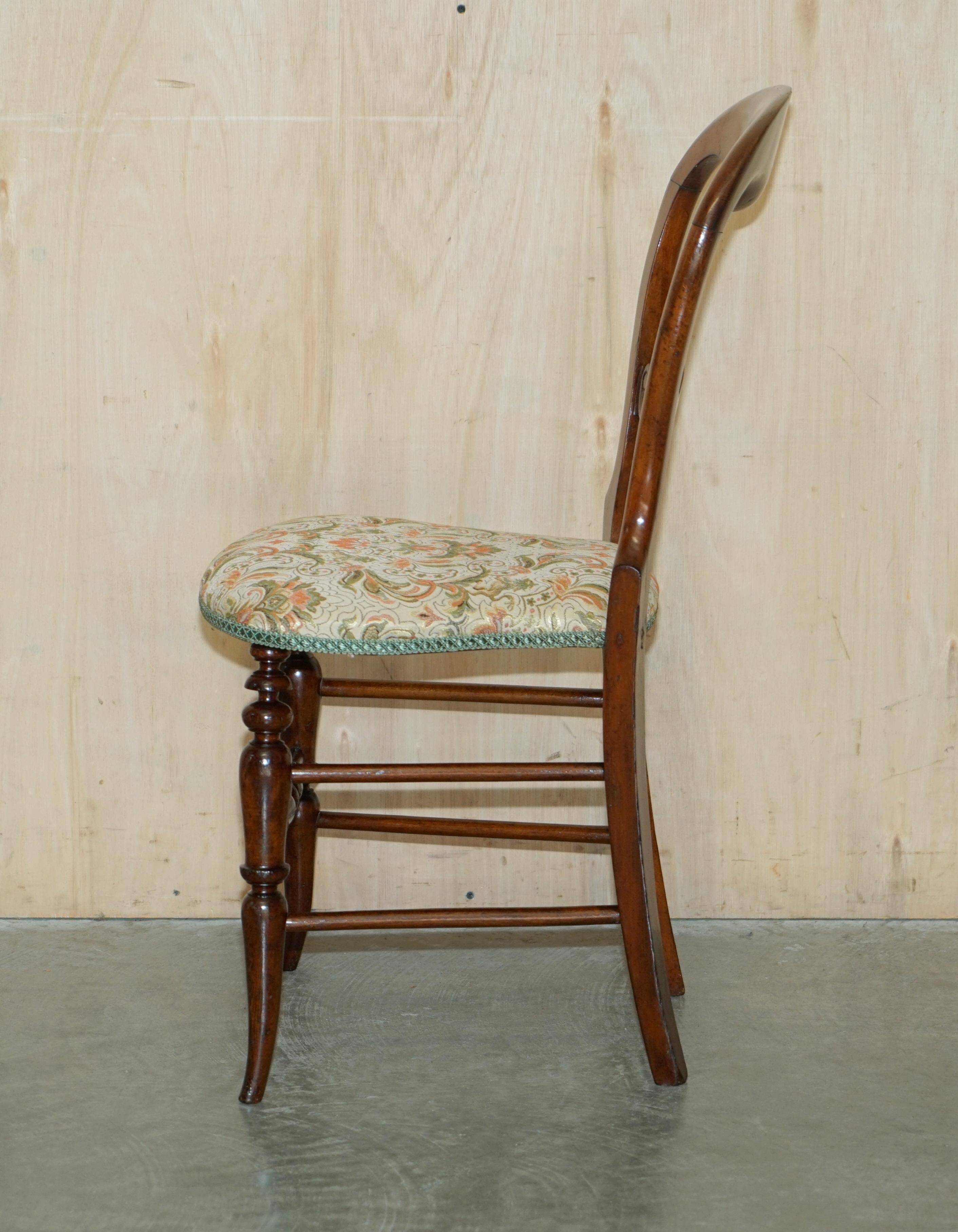 Victorian walnut dressing table chair from around 1880 with a medallion on the backrest.