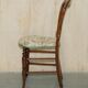 Victorian walnut dressing table chair from around 1880 with a medallion on the backrest.