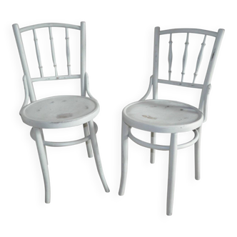 Pair of Lichtig bistro chairs in painted grey beech, pressed seat, circa 1900.