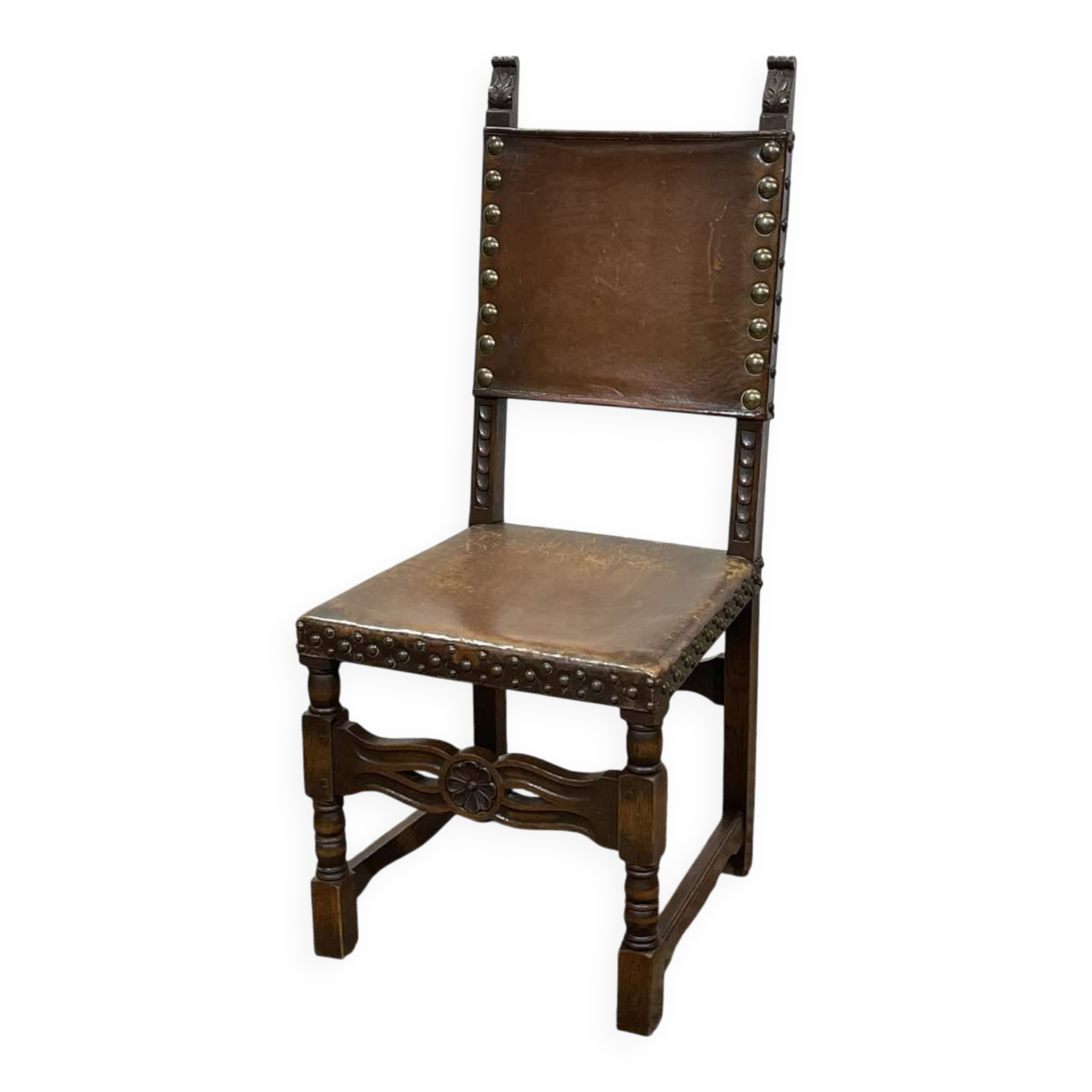 High-backed chair from the early 20th century in oak and leather