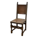 High-backed chair from the early 20th century in oak and leather