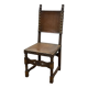 High-backed chair from the early 20th century in oak and leather