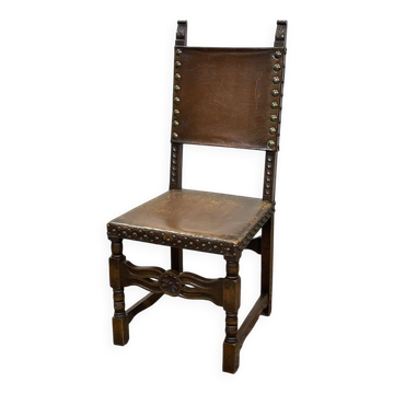 High-backed chair from the early 20th century in oak and leather