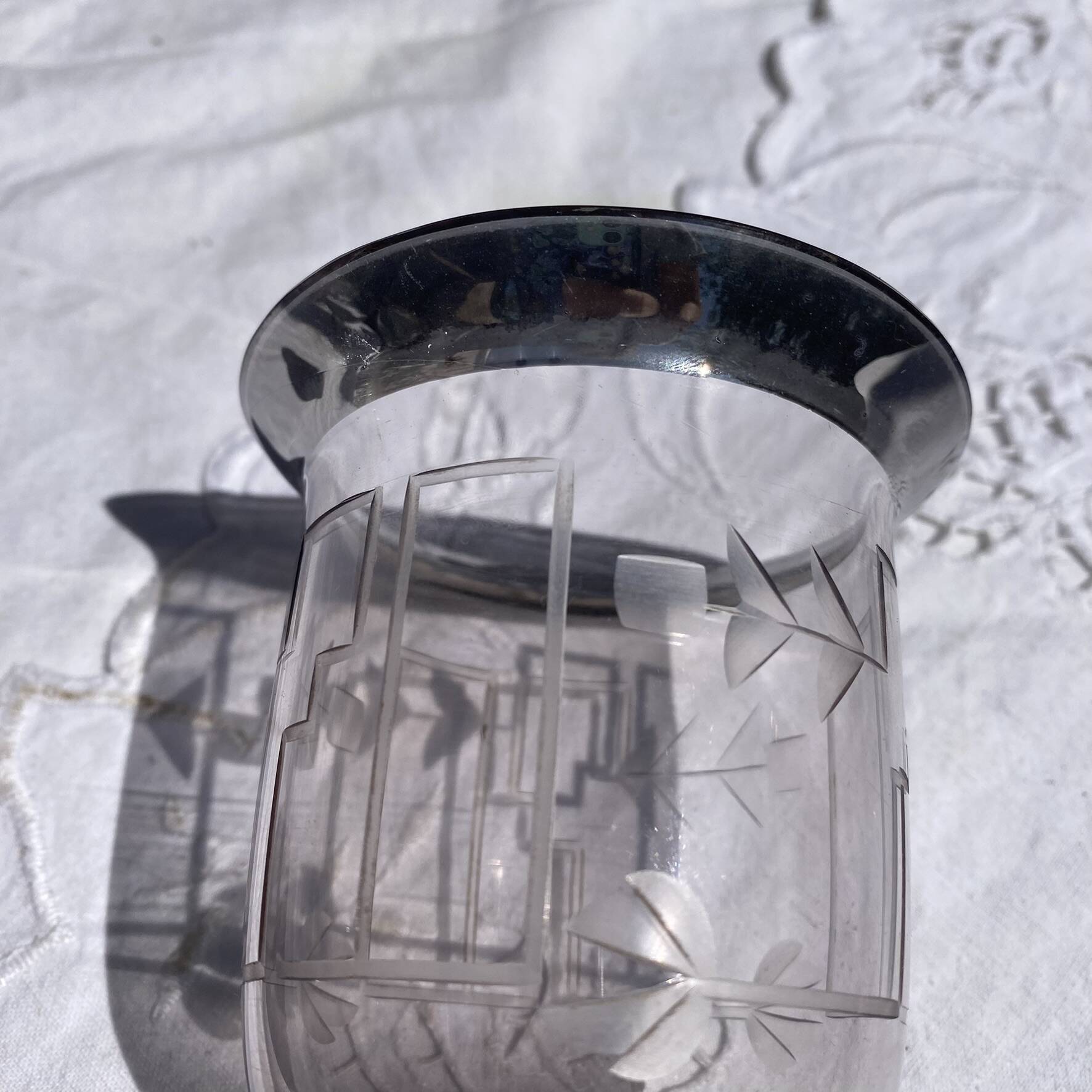 Antique Art Deco engraved glass, silvered rim and base.