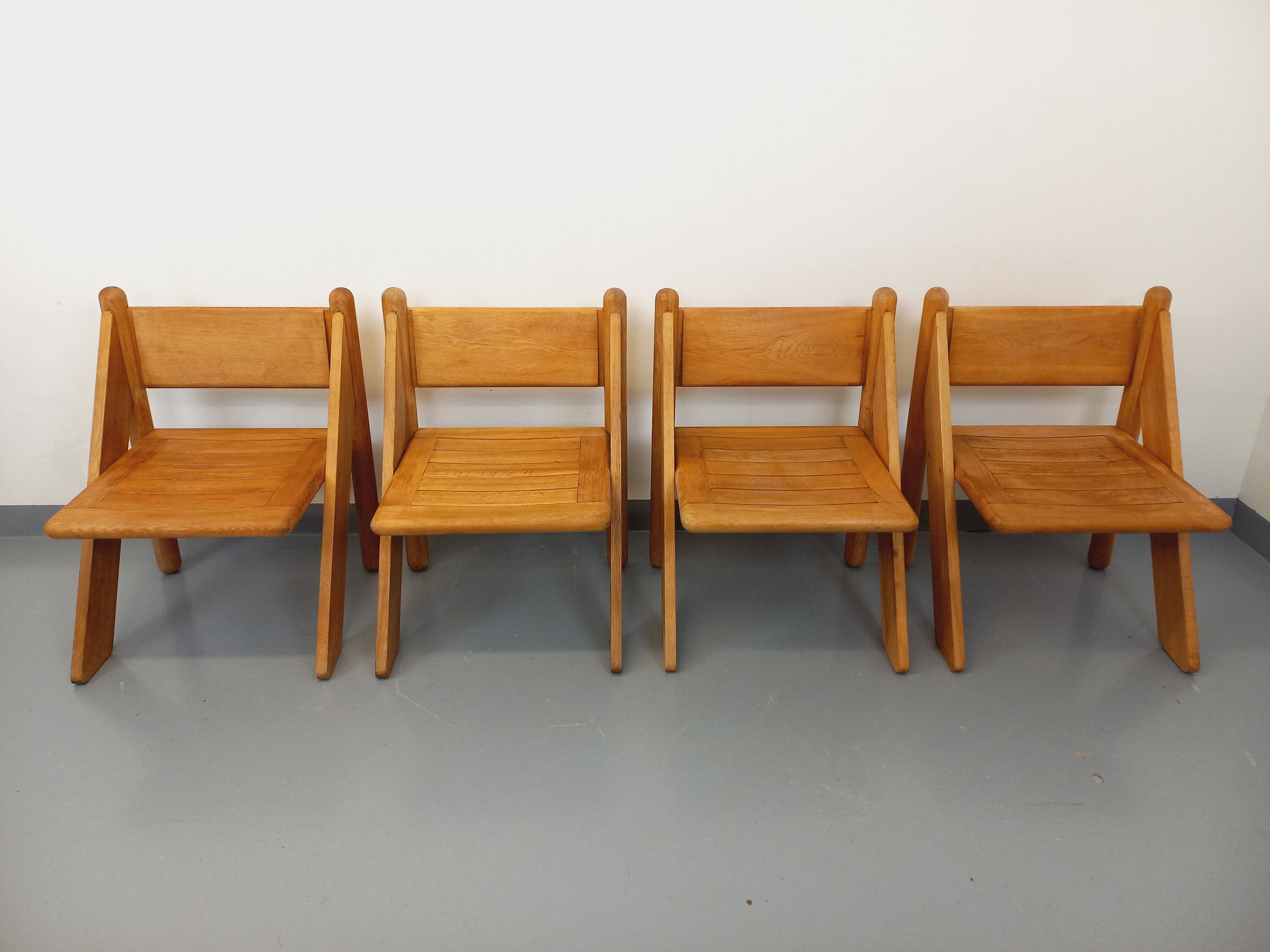 Set of 4 vintage brutalist chairs in solid oak from the 1960s.