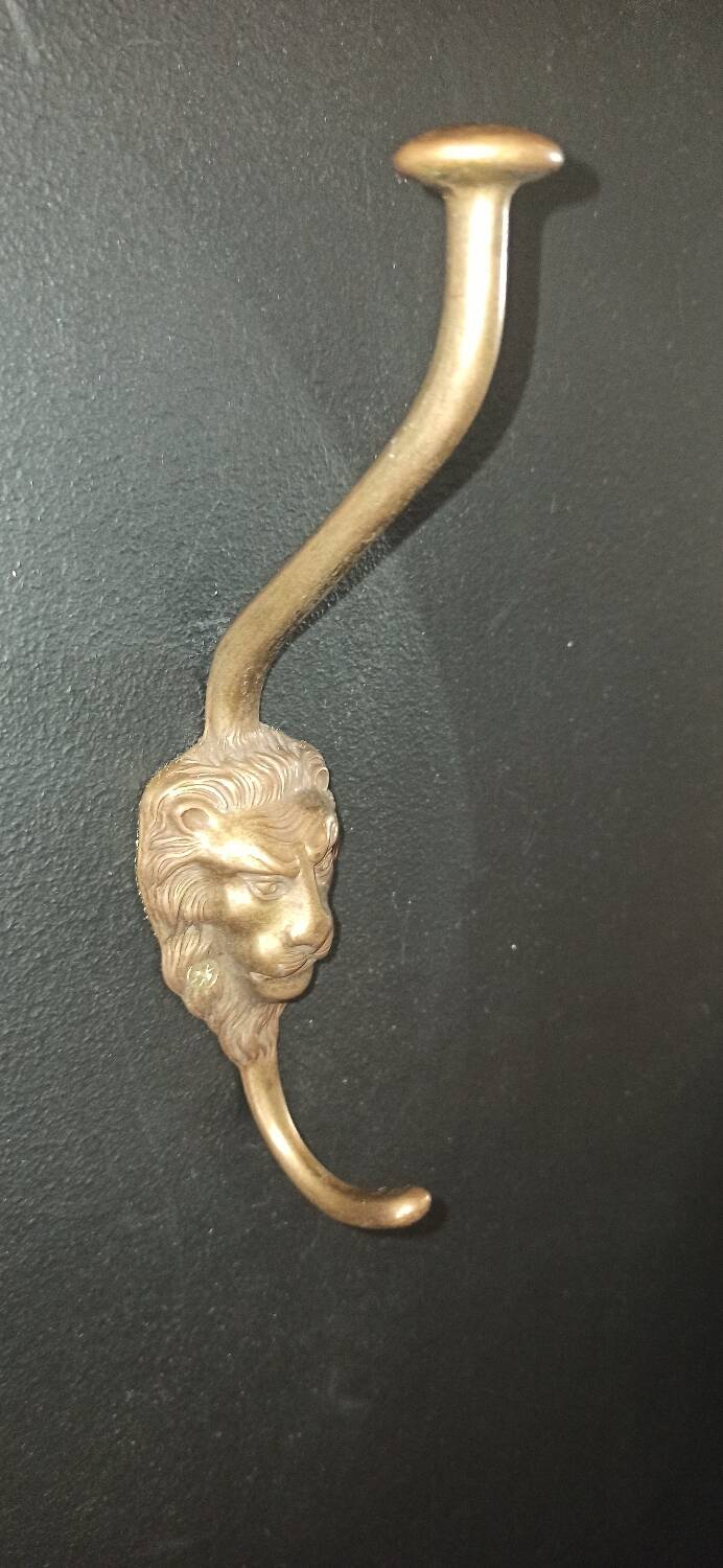 Set of 5 antique "Lion Head" coat hooks.