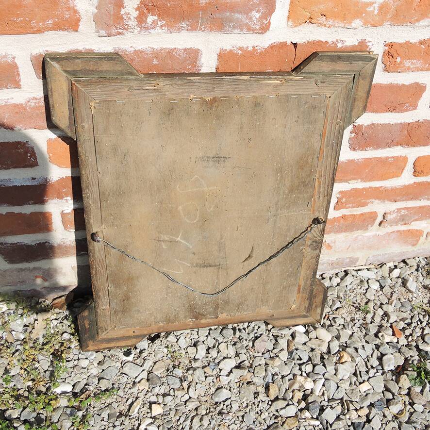 Old wooden and gilded stucco mirror