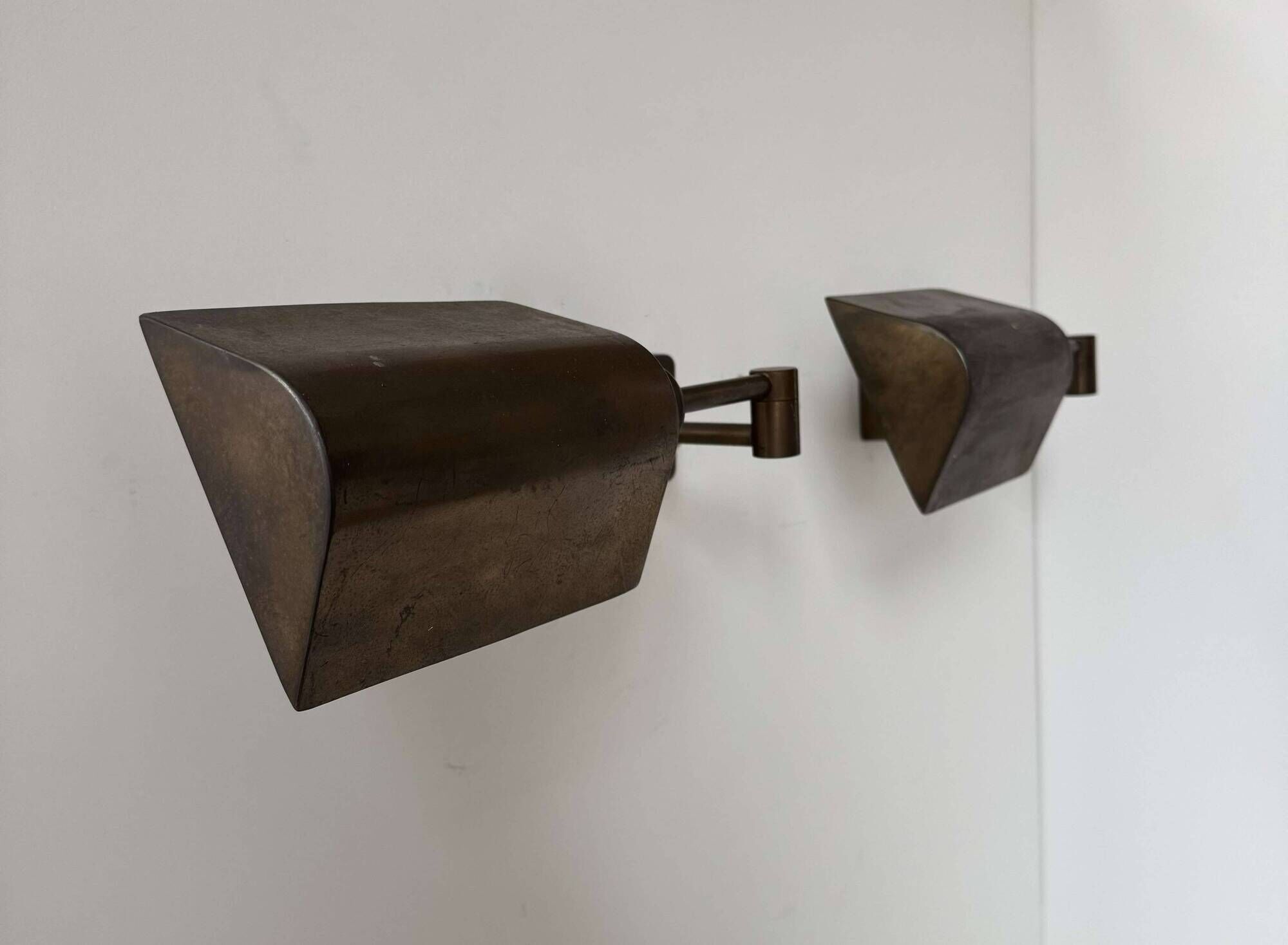 Pair of vintage adjustable wall lights, patinated brass, France 1970.