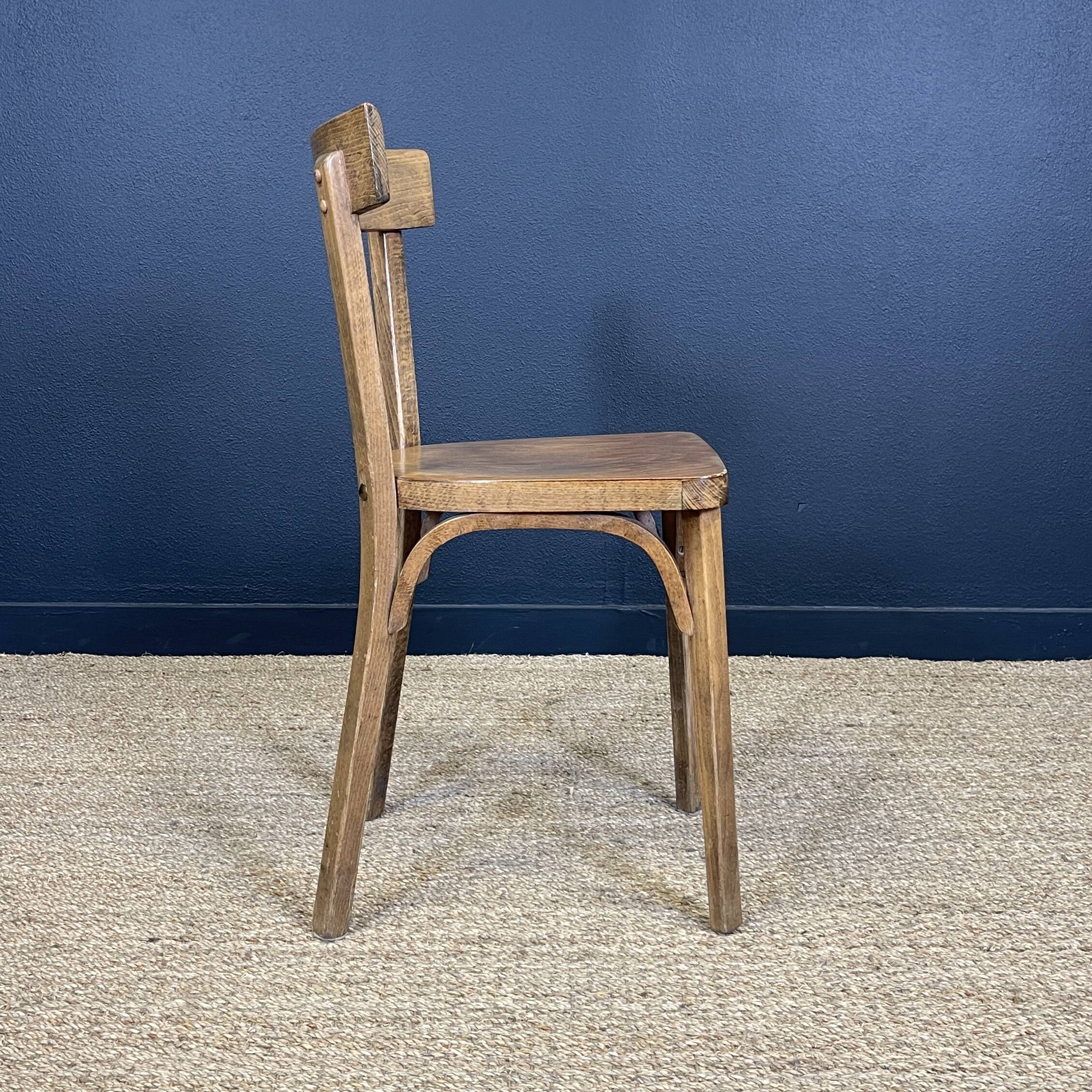 Set of 26 Baumann wooden bistro chairs from the 1950s France