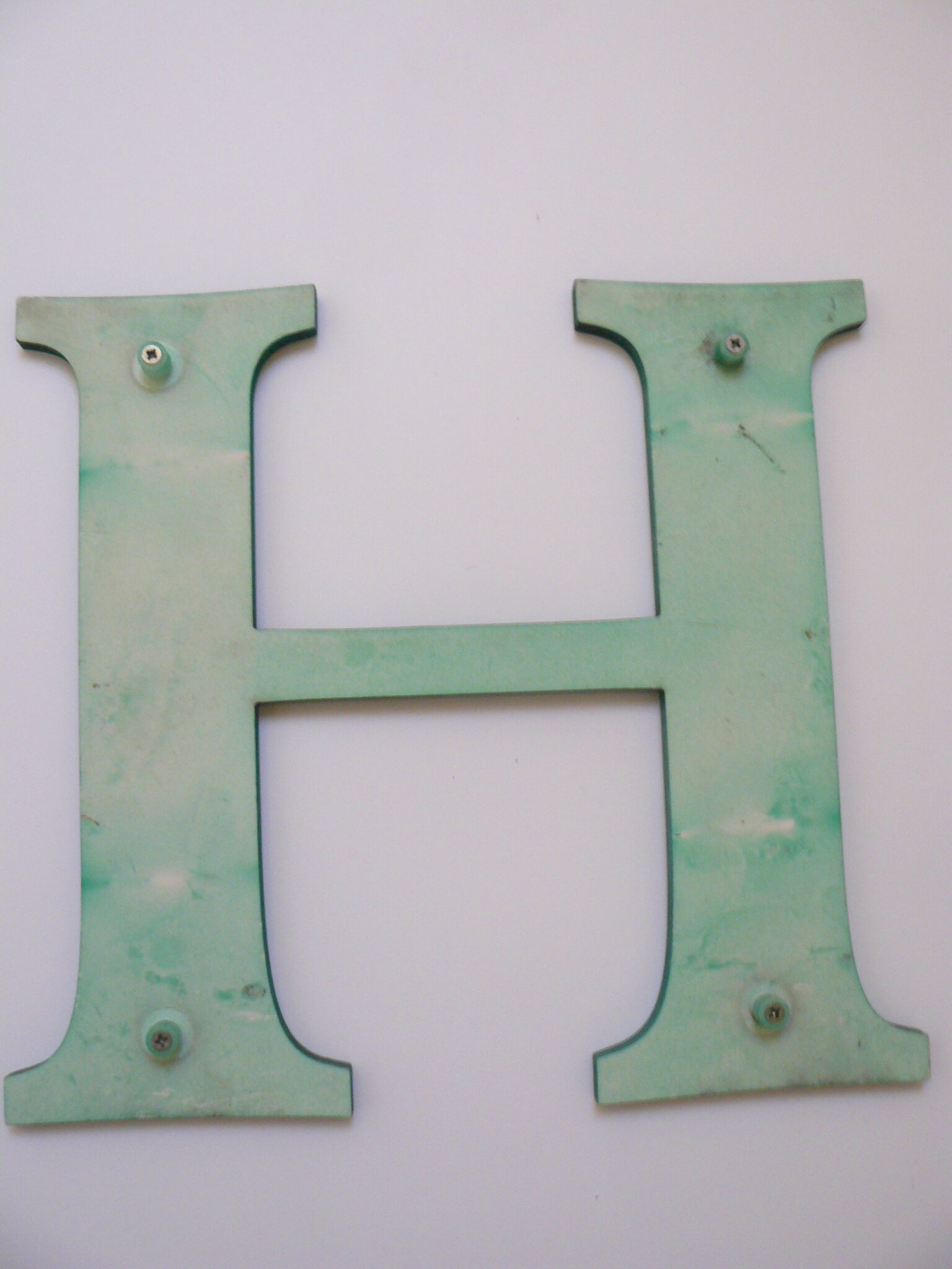 Teaches letter H of green color