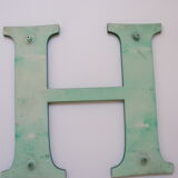 Teaches letter H of green color