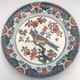 Wall plate in earthenware decorated with painting of flowers and bird 28 cm