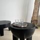 Black mango wood tripod side table with a semi-spherical top, height: 45 cm, diameter: 44 cm.