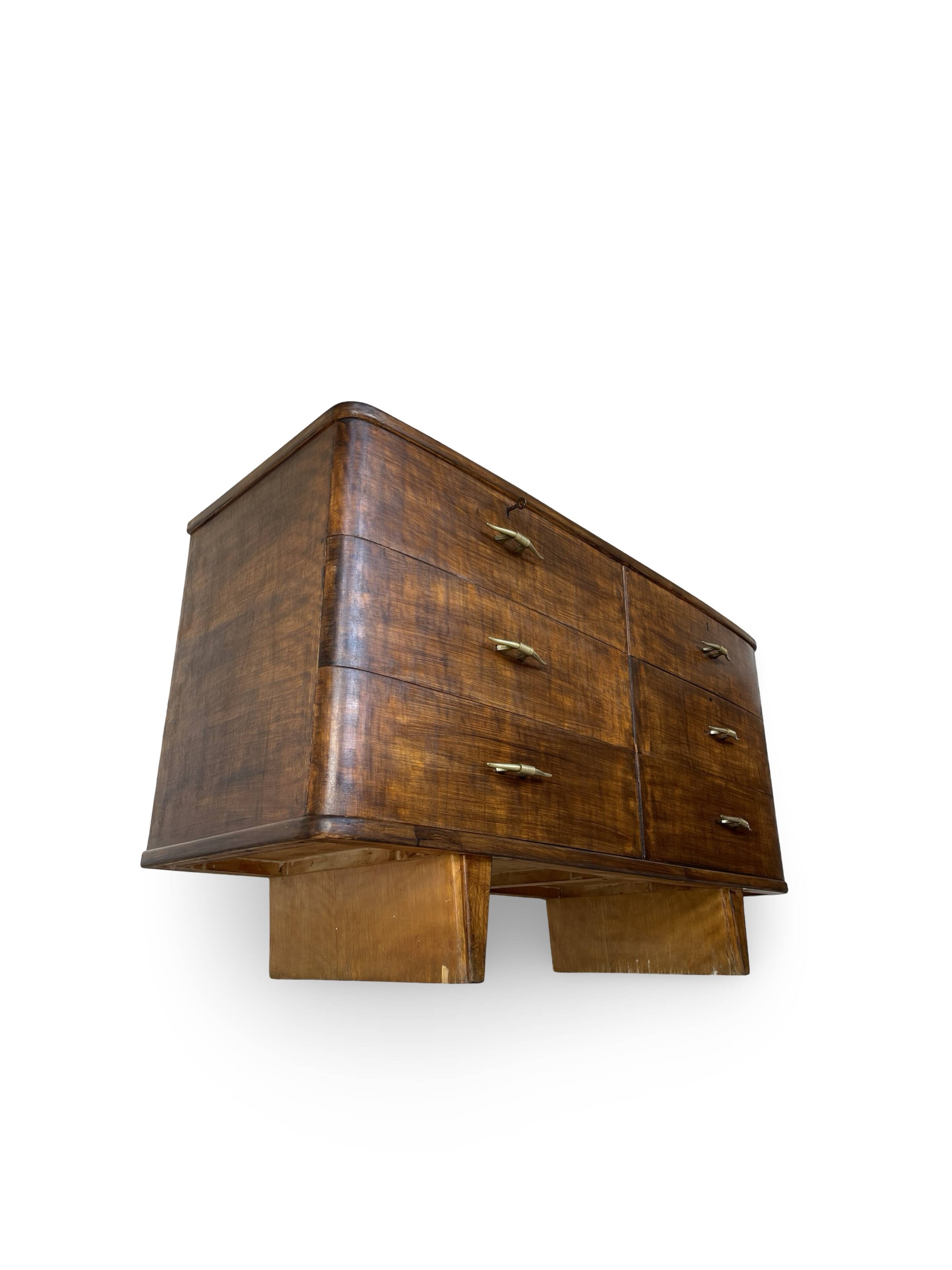 A vintage Italian chest of drawers, made of veneered walnut and solid wood,