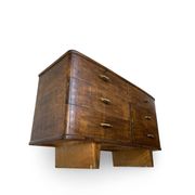 A vintage Italian chest of drawers, made of veneered walnut and solid wood,