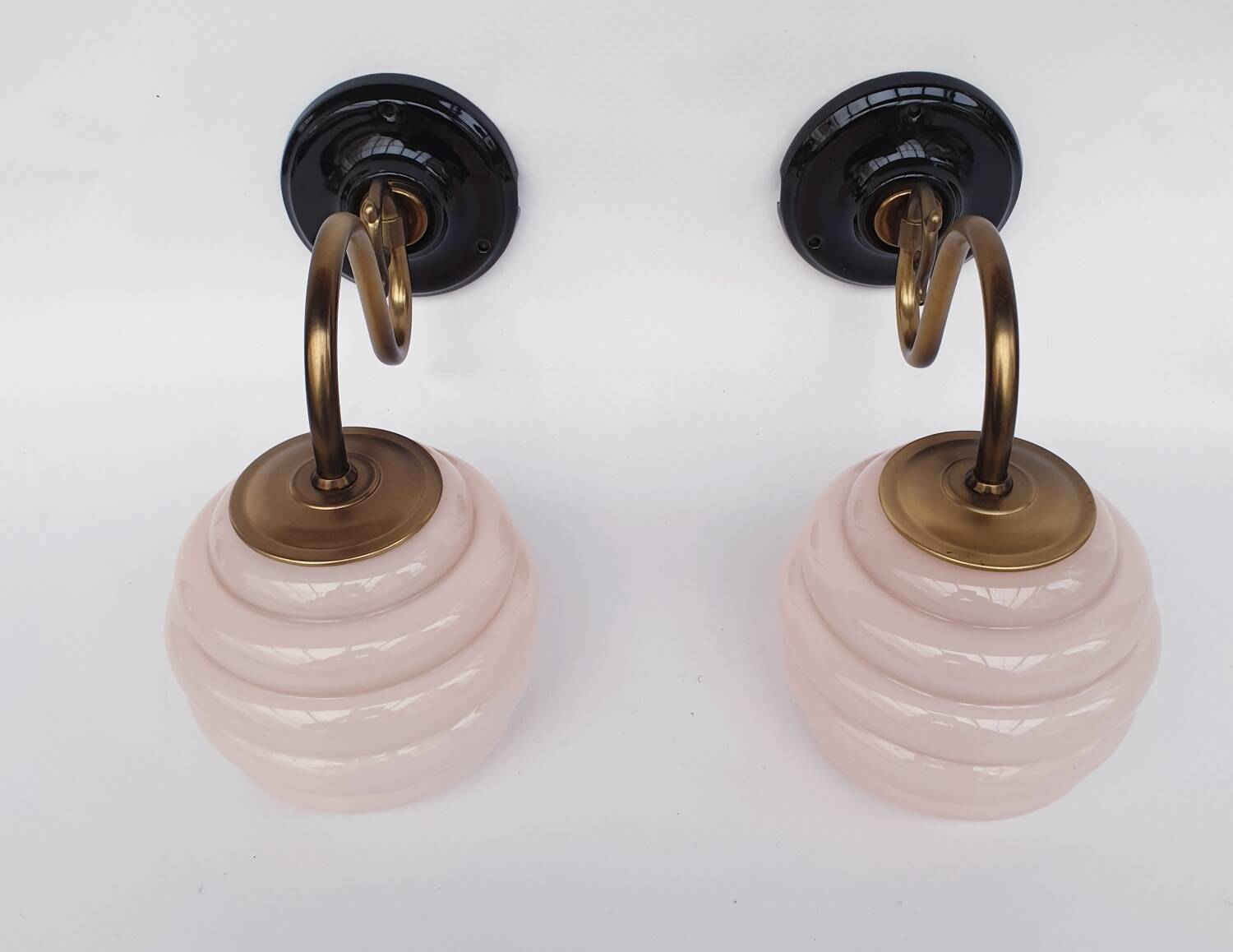 Brass and glass swan neck wall lights