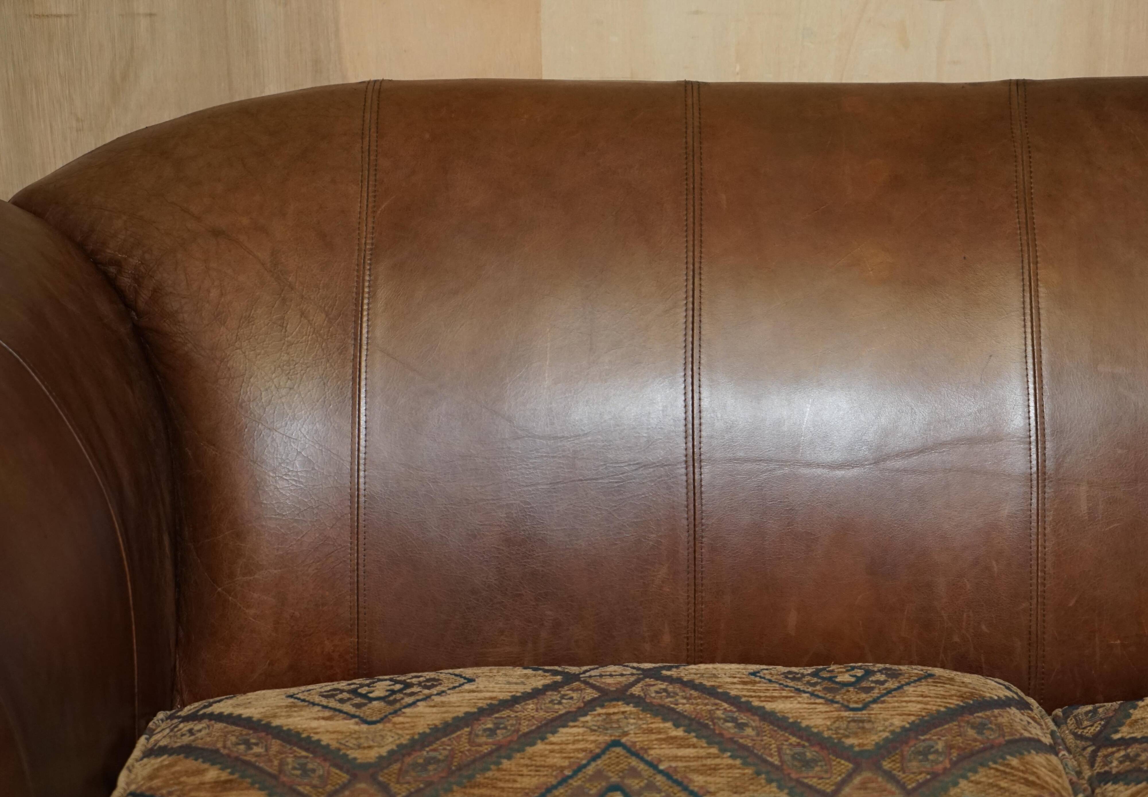 Vintage leather sofas by Thomas Lloyd with Kilim cushions.