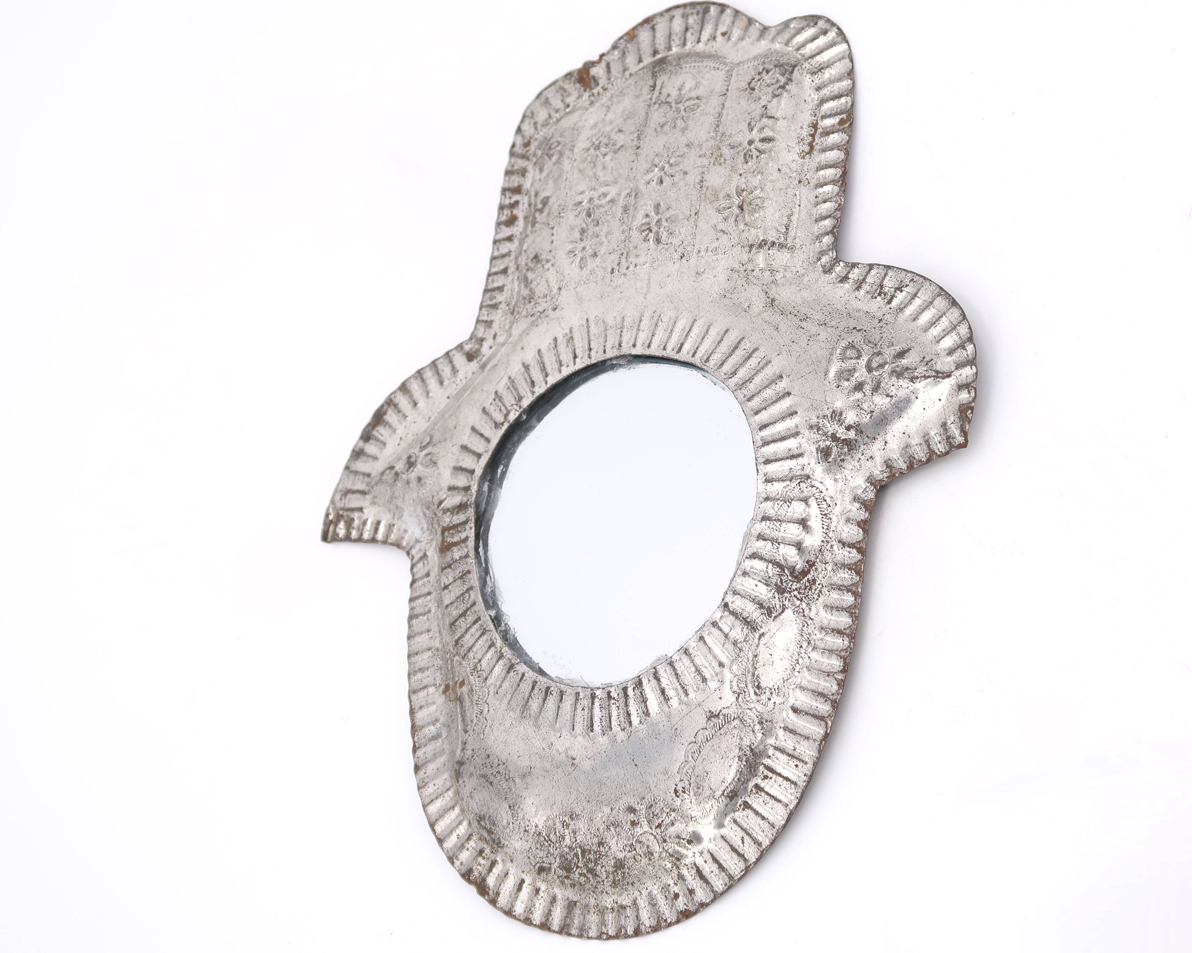 Moroccan metal mirror in the shape of a hand, 1970s