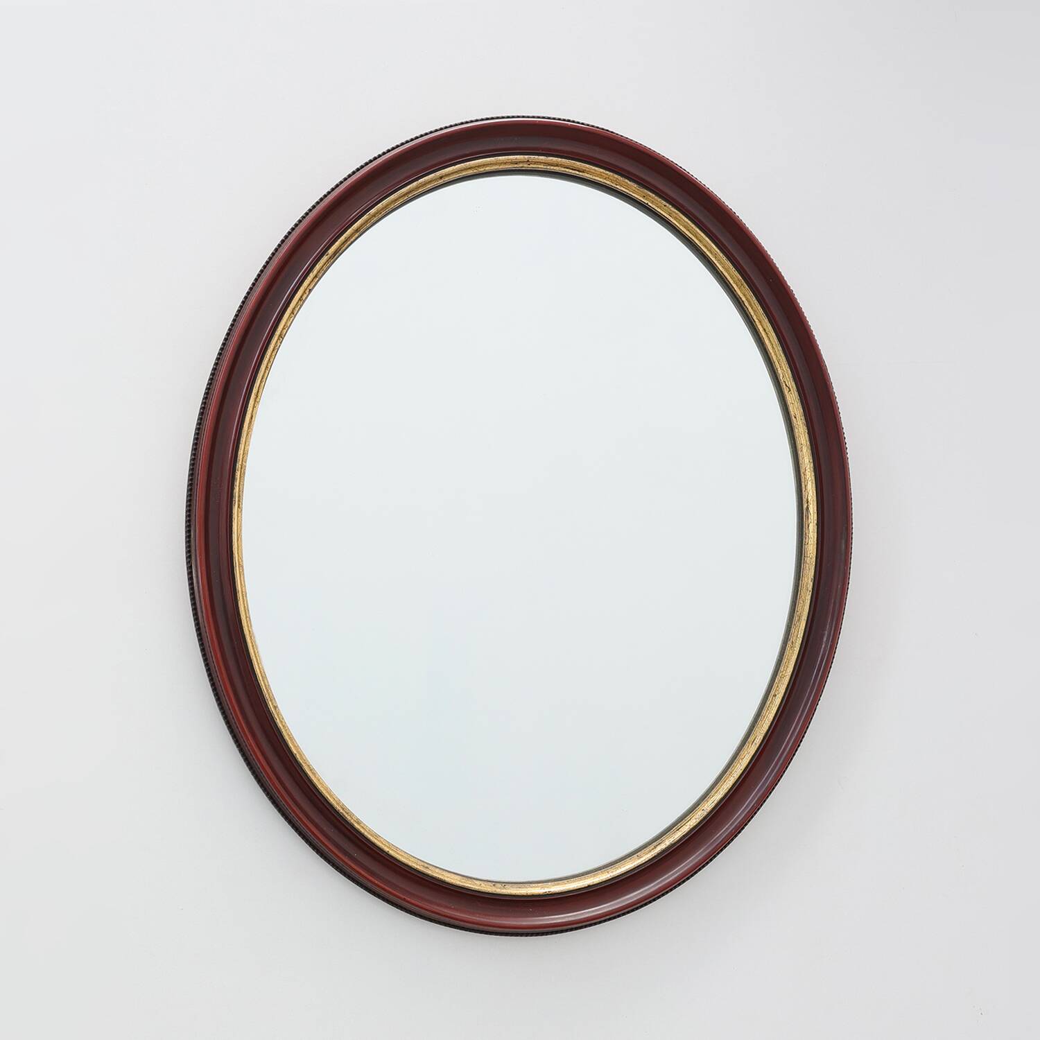 French Burgundy Lacquered Oval Mirror with Gilt Inner Edge, circa 1920
