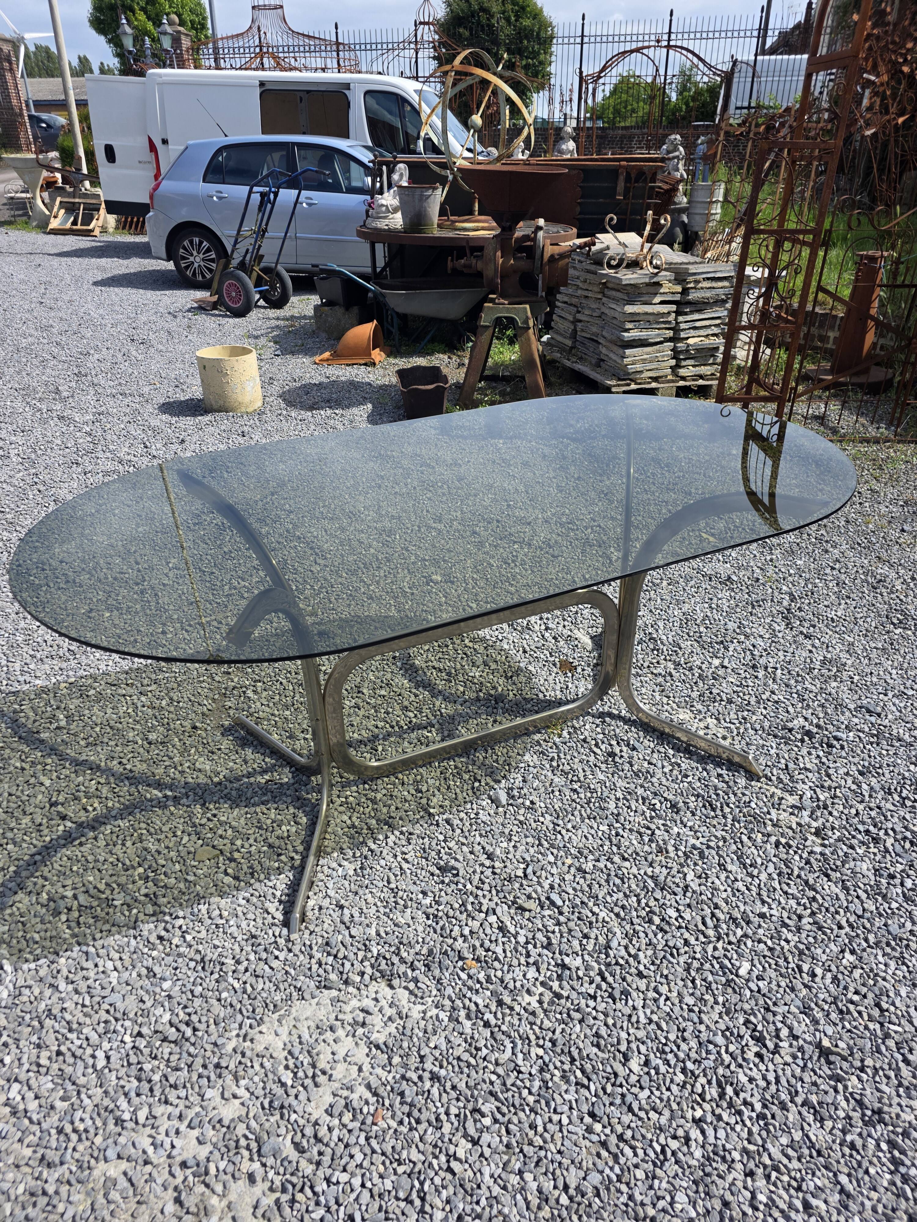 Silver metal table with smoked glass top from the 1970s.