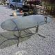 Silver metal table with smoked glass top from the 1970s.