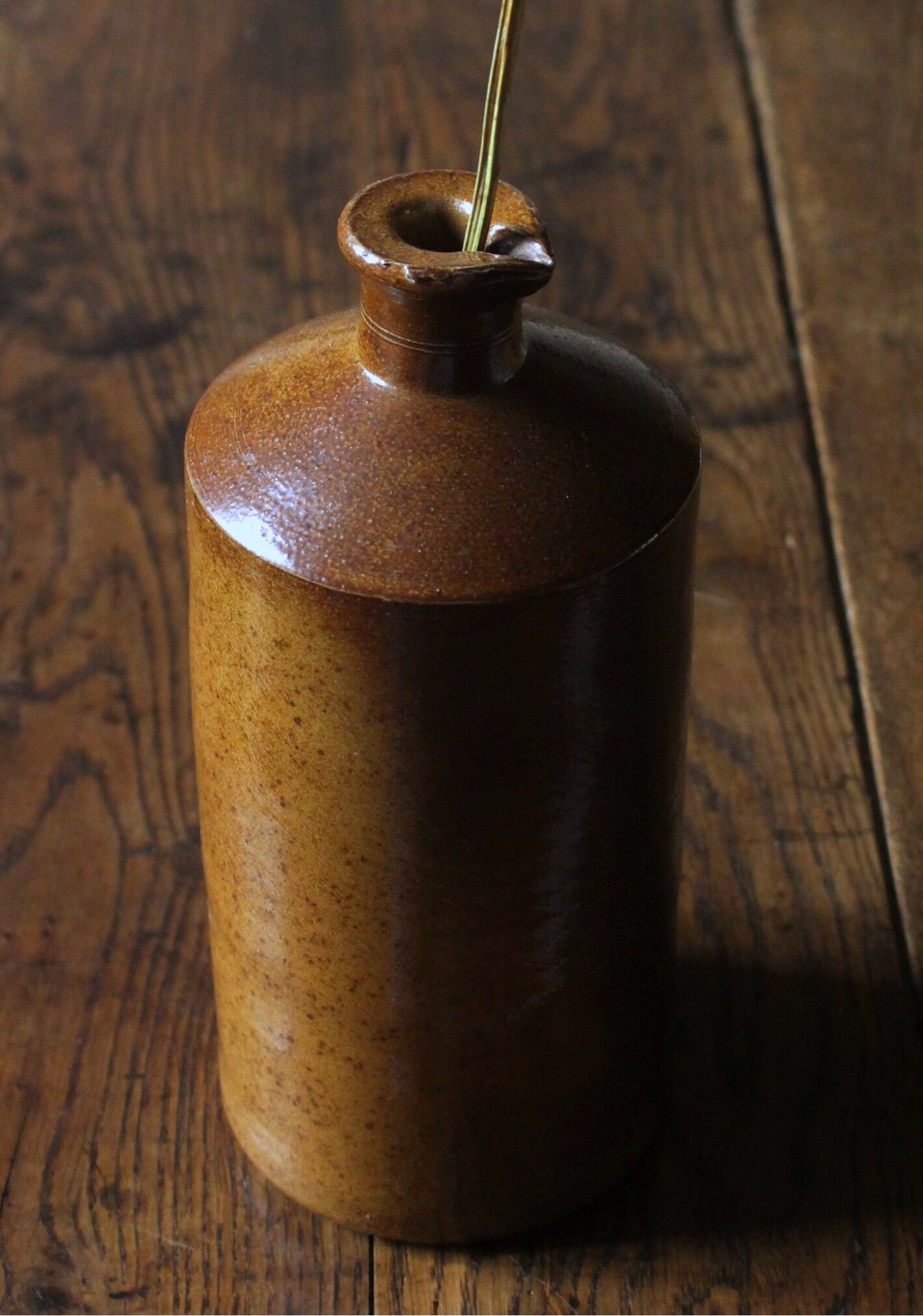 Vintage Bourne Deney stoneware liqueur bottle with pouring spout.