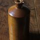 Vintage Bourne Deney stoneware liqueur bottle with pouring spout.