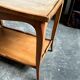 Coffee table, side table in light wood with saber legs.