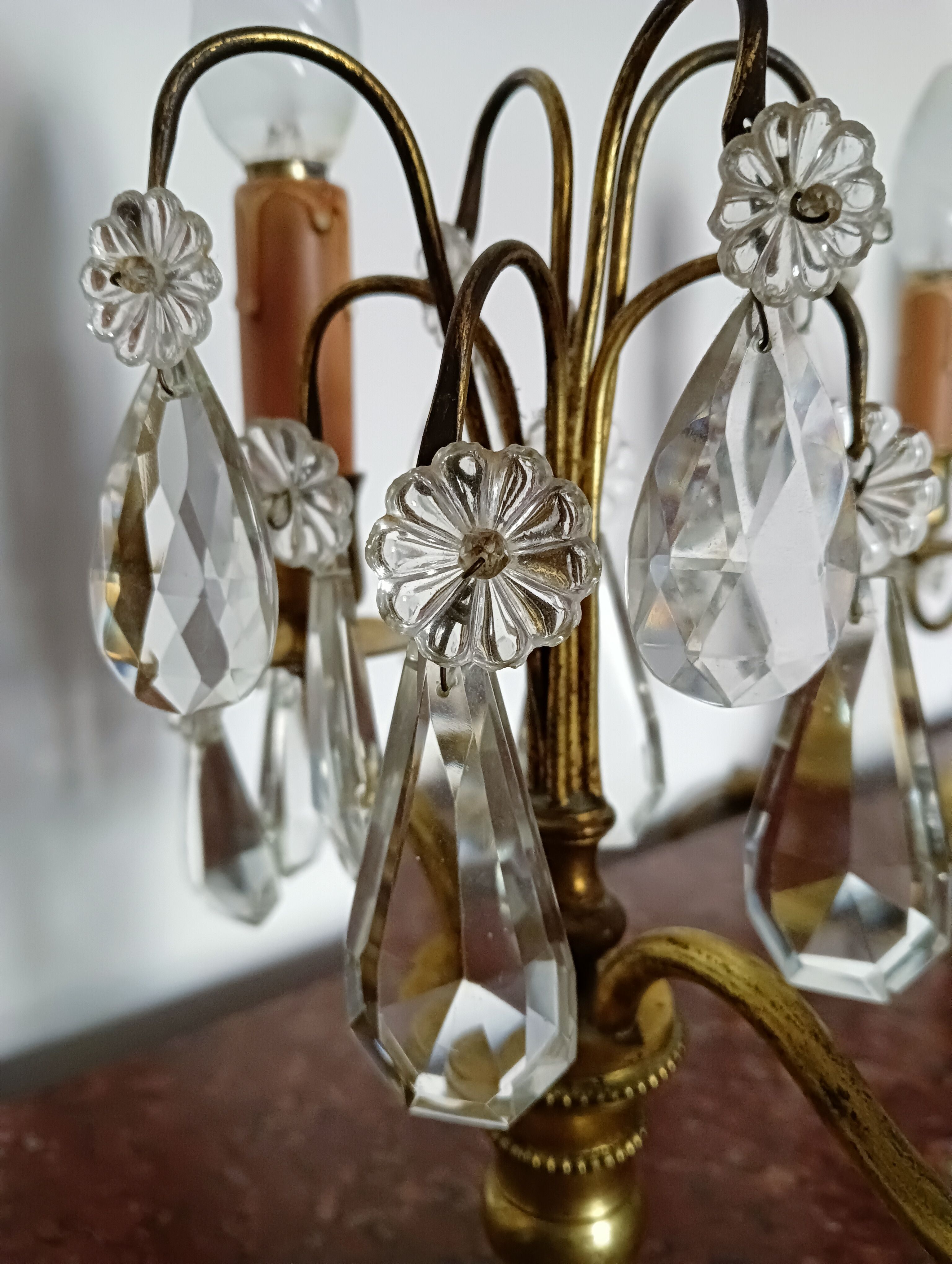 Pair of bronze girandoles with crystal pendants, two arms of lights.