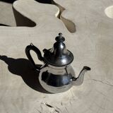 Silver-plated teapot with black handle