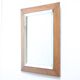 Art deco beveled mirror in an oak frame, 1940s.
