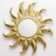 Large handcrafted sun mirror in wood and gilded stucco with gold leaf from the 1970s-80s.