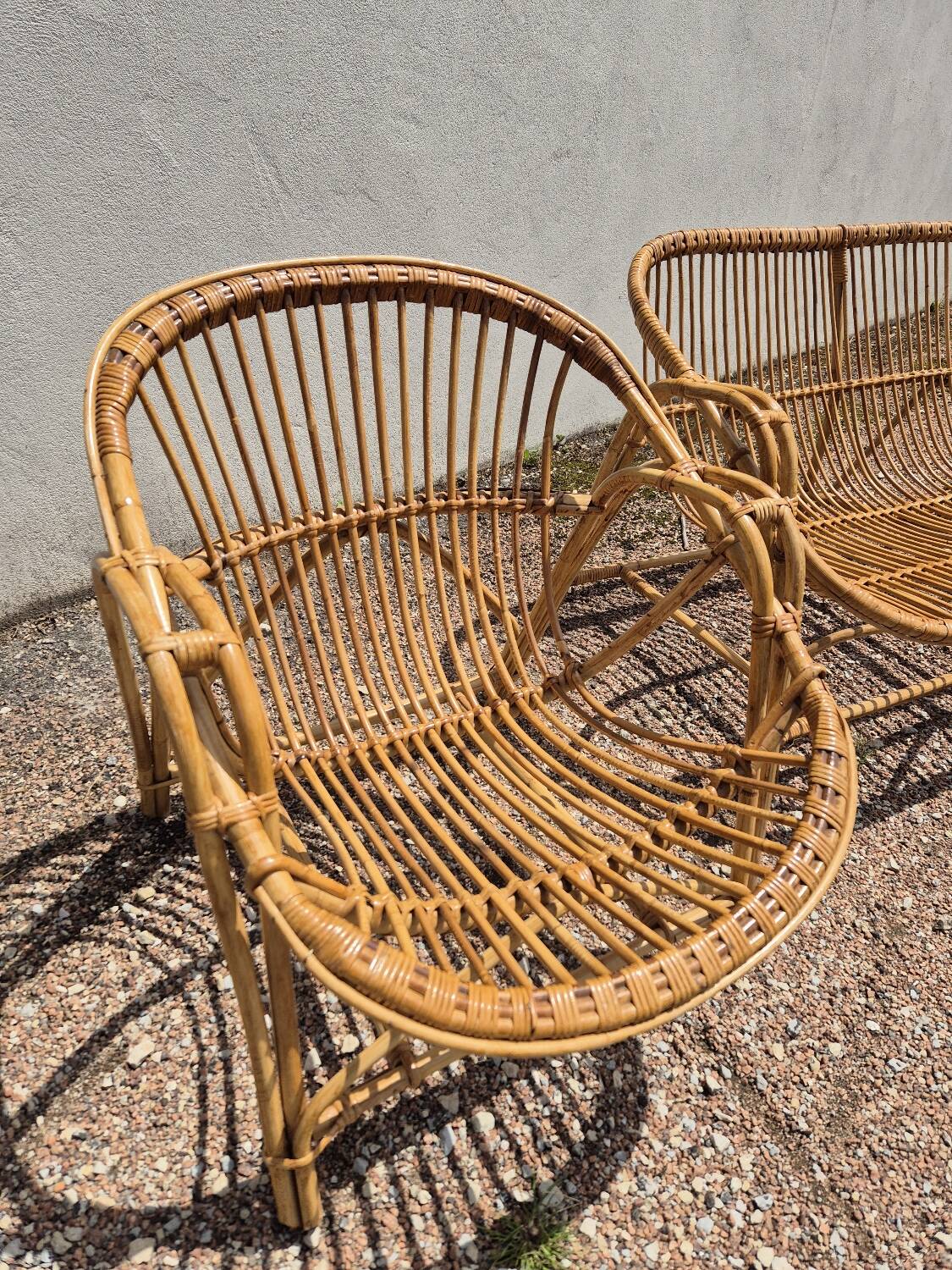 Rattan lounge with two armchairs and a vintage 1950s bench.