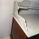 Antique wood and marble kitchen sideboard with carved backsplash