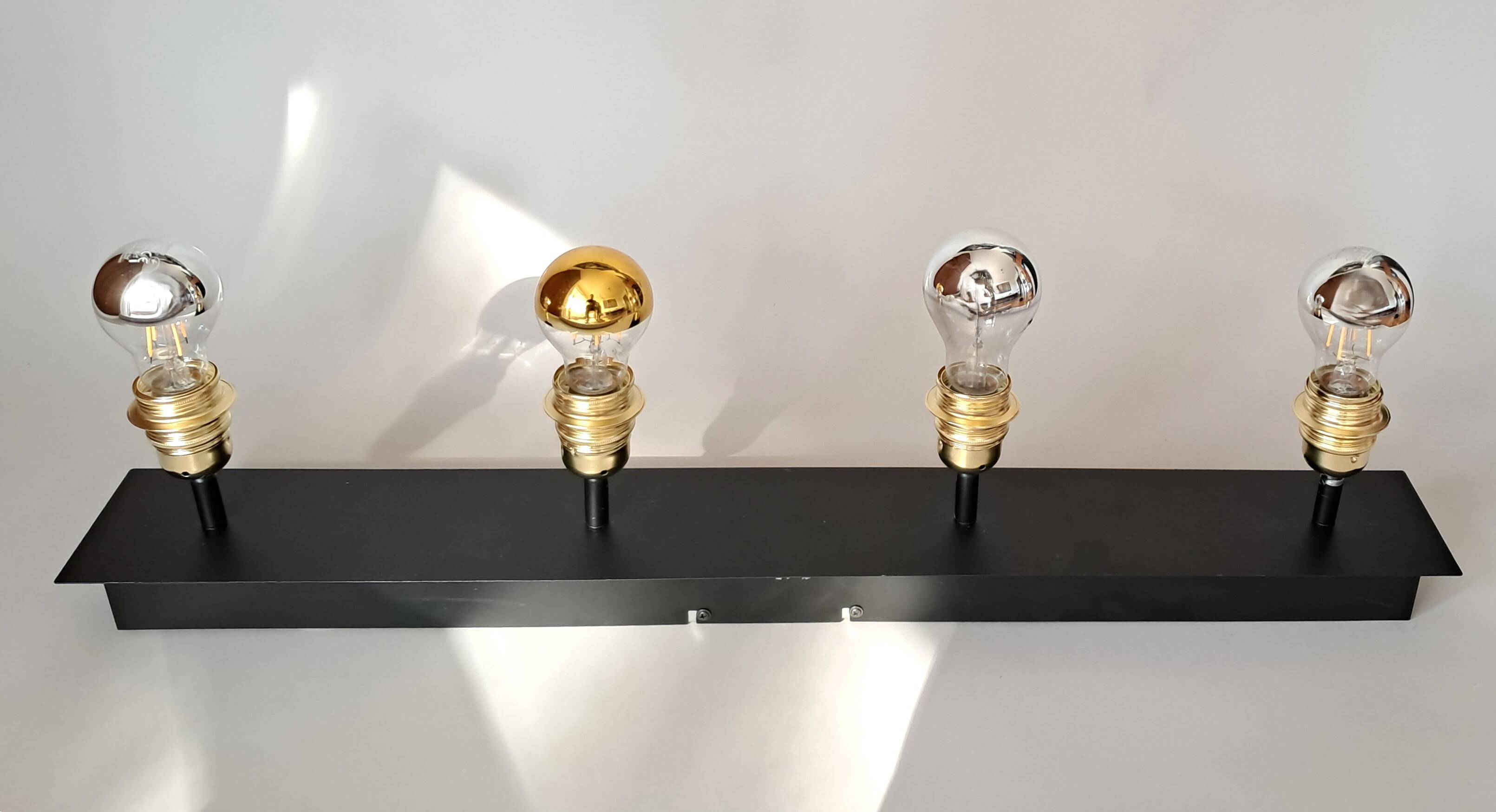 Wall lamp with 4 adjustable lights in black metal and gold-plated brass sockets.