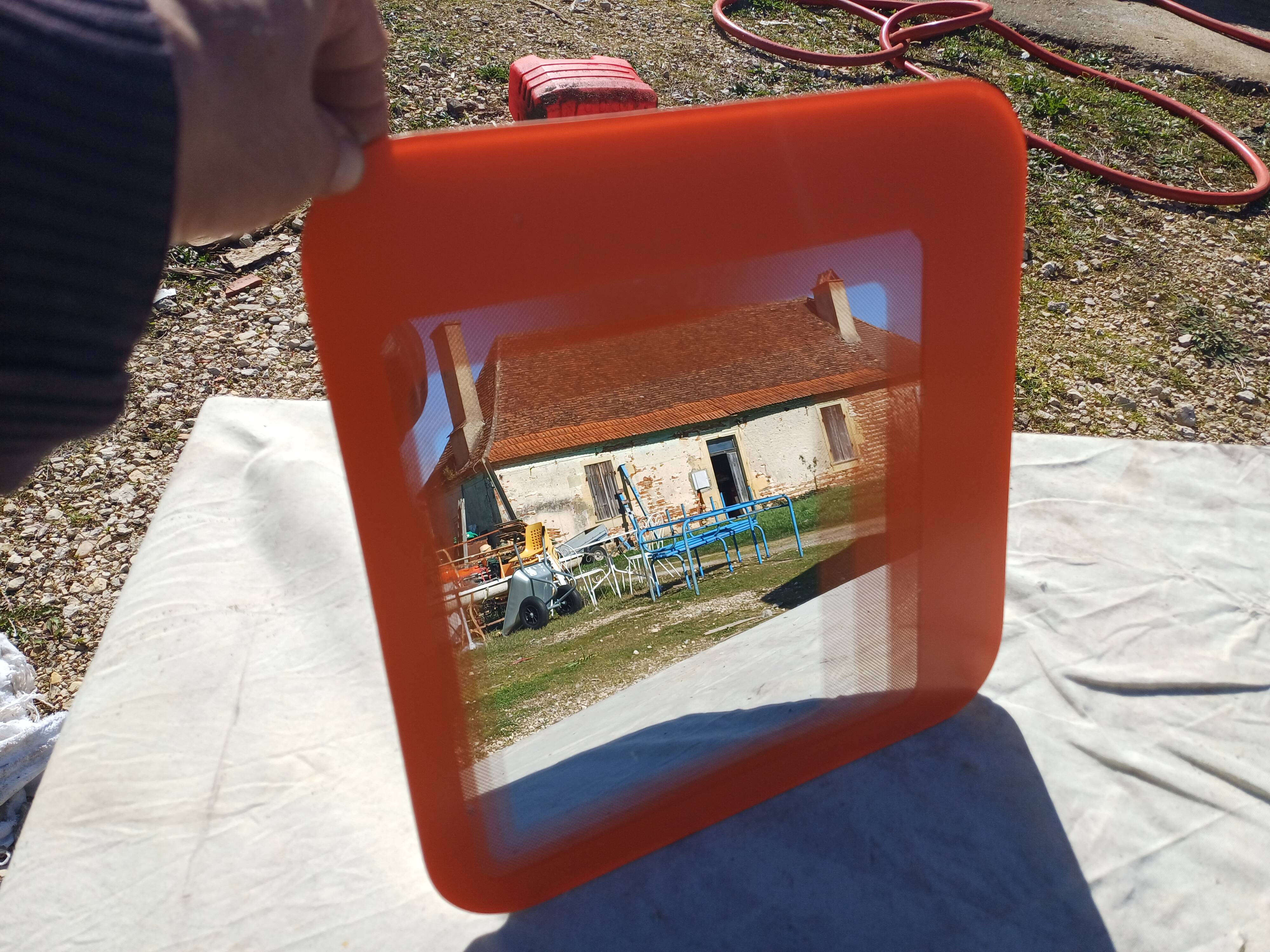 Vintage orange glass mirror